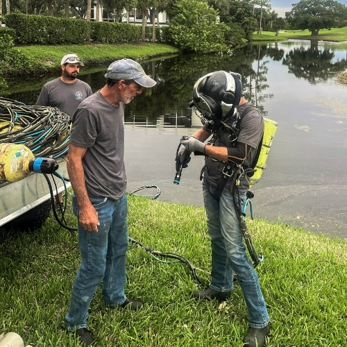 Commercial diver inspecting a Florida canal