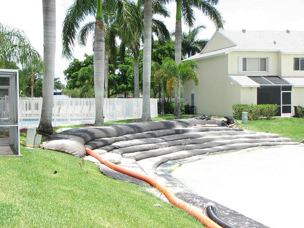 Stacked Geo Tubes along an Oakbridge residential shoreline during installation
