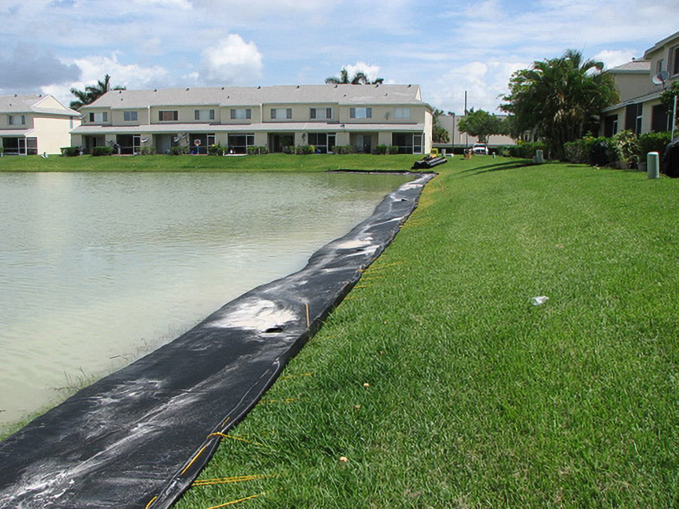 Geo Tube fabric along an Oakbridge pond bank during residential shoreline restoration