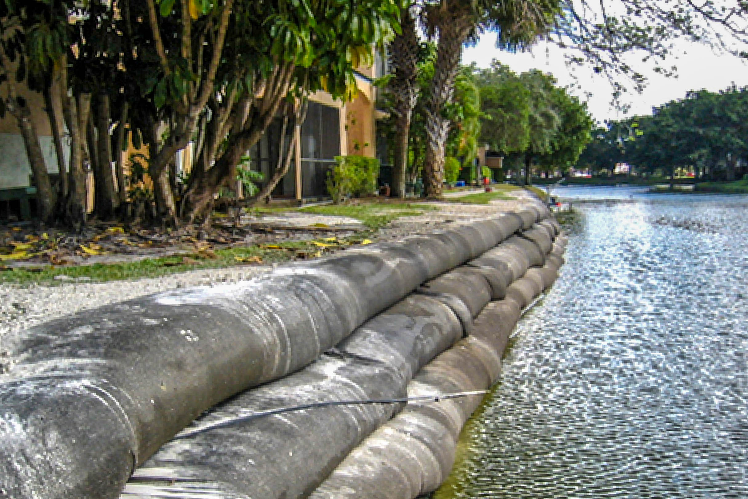 AIMCO residential community canal lined with Geo Tubes during installation