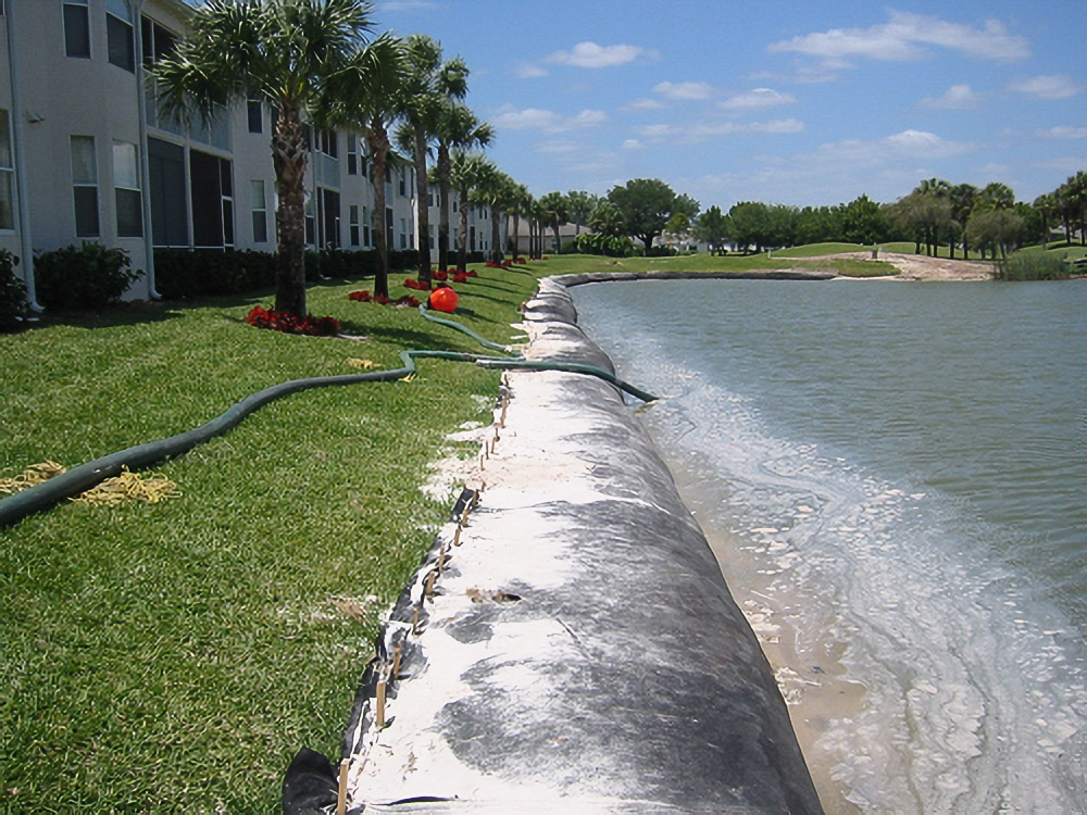 Geo Tube installation along a The Villages condo shoreline during restoration